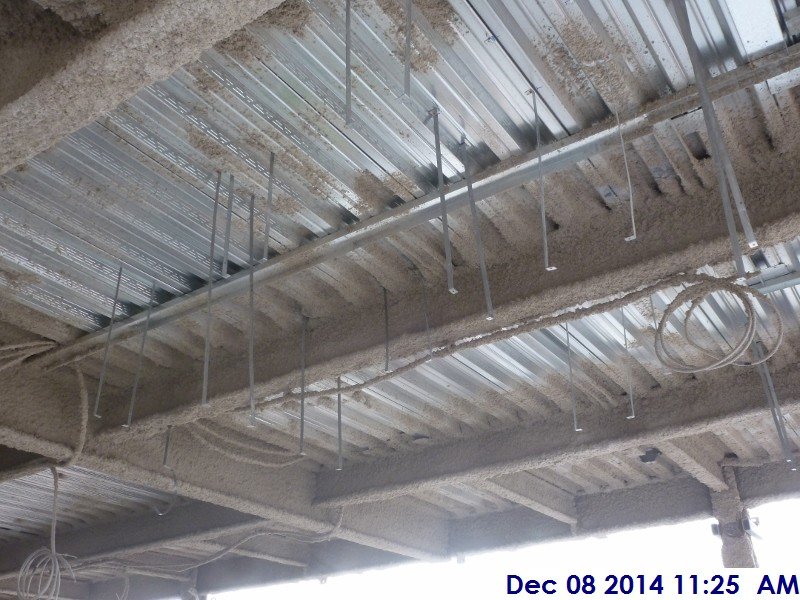 Installing duct work hangers at the 3rd floor Facing North